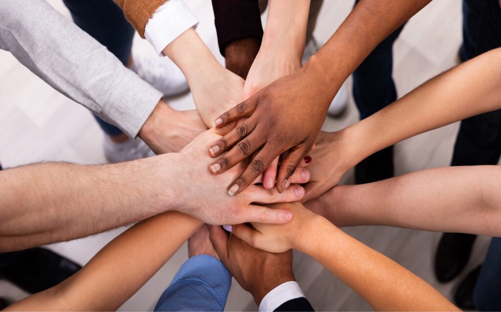 Group of hands together in a circle