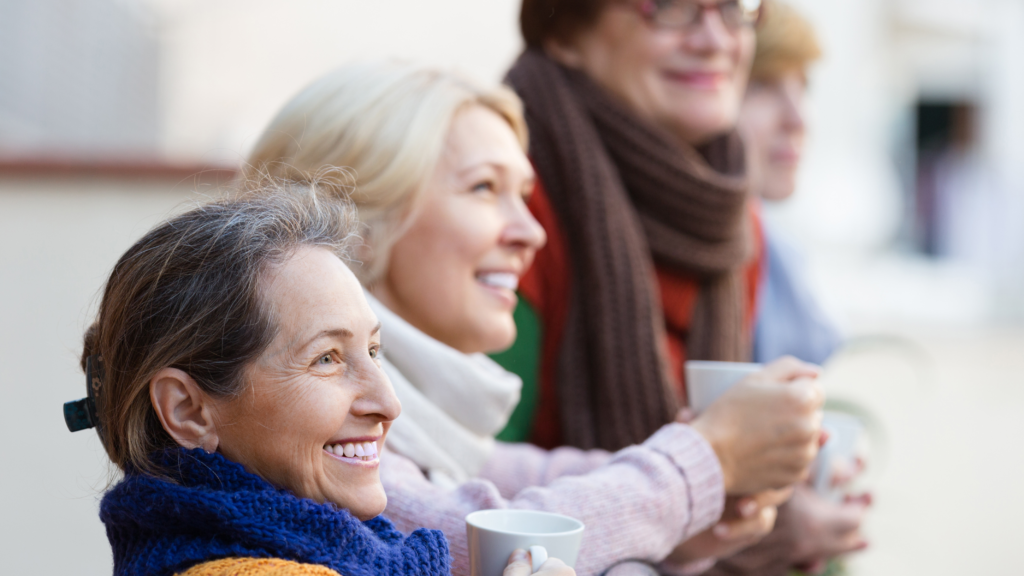 A group of people standing and smiling