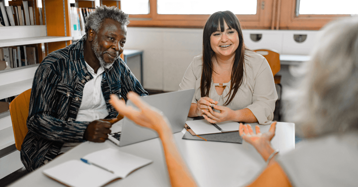 People sitting around a table and talking 